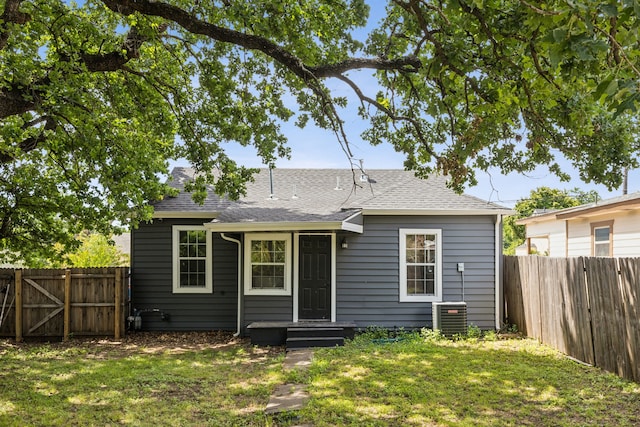 1215 Morrell Ave, Dallas, TX 75203 - rear view of property with cooling unit and roof with shingles