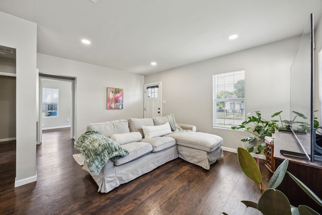 1215 Morrell Ave, Dallas, TX 75203 - living room with dark wood finished floors, healthy amount of natural light, recessed lighting, and baseboards