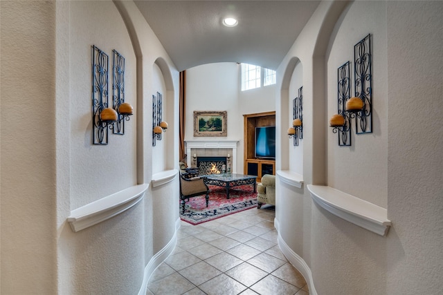 1113 Waterford Way, Allen, TX 75013 - hall featuring lofted ceiling, a textured wall, light tile patterned floors, and baseboards