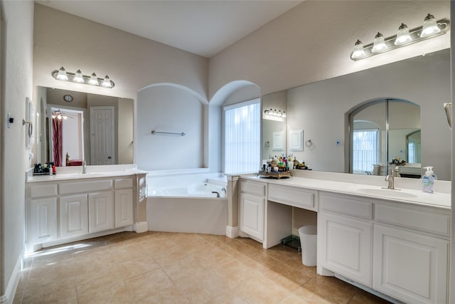 1113 Waterford Way, Allen, TX 75013 - bathroom featuring two vanities, a bath, healthy amount of natural light, and tile patterned floors