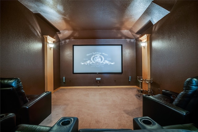 1113 Waterford Way, Allen, TX 75013 - carpeted home theater room with vaulted ceiling, decorative columns, a textured wall, a textured ceiling, and baseboards