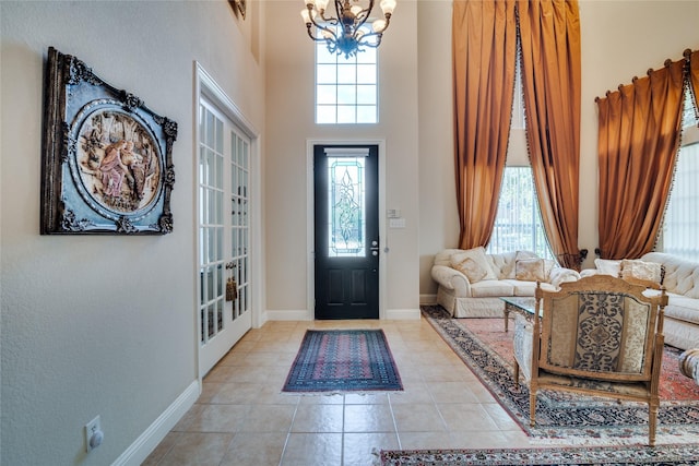 1113 Waterford Way, Allen, TX 75013 - tiled entryway with a chandelier, a towering ceiling, and baseboards