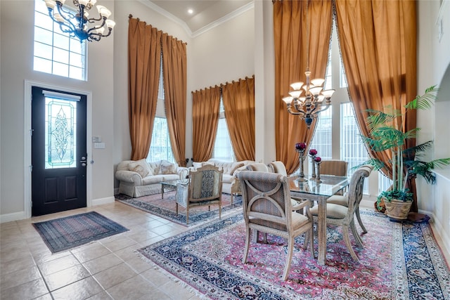 1113 Waterford Way, Allen, TX 75013 - dining space with a chandelier, a high ceiling, ornamental molding, baseboards, and tile patterned floors