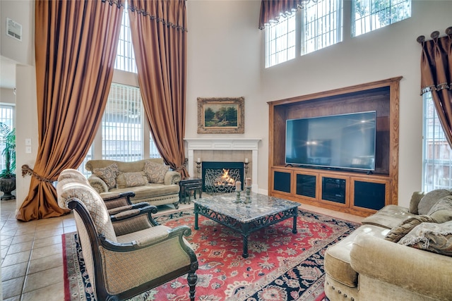 1113 Waterford Way, Allen, TX 75013 - tiled living room with a towering ceiling, plenty of natural light, and a tiled fireplace