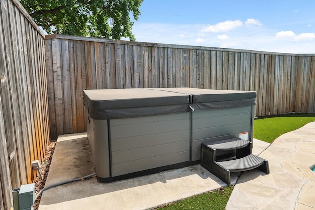 1646 Belltower Dr, Lewisville, TX 75067 - fenced backyard with a hot tub and a patio area