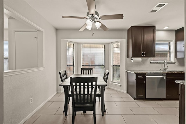 1646 Belltower Dr, Lewisville, TX 75067 - kitchen featuring dishwasher, a ceiling fan, dark brown cabinetry, a sink, and baseboards