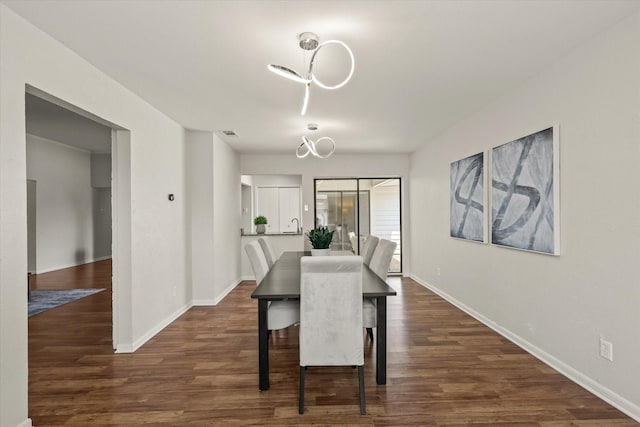 1646 Belltower Dr, Lewisville, TX 75067 - dining space with dark wood-type flooring and baseboards
