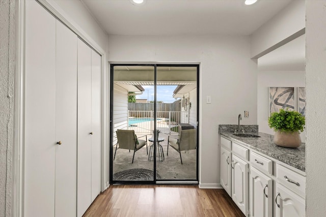 1646 Belltower Dr, Lewisville, TX 75067 - entryway with light wood-style floors, a sink, and recessed lighting