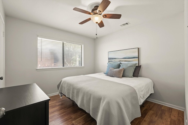 1646 Belltower Dr, Lewisville, TX 75067 - bedroom featuring baseboards, wood finished floors, and a ceiling fan