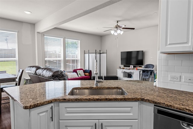 3657 Harebell Dr, Carrollton, TX 75007 - kitchen with open floor plan, a sink, stainless steel dishwasher, a ceiling fan, and white cabinetry