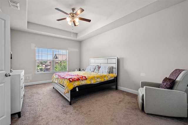 3657 Harebell Dr, Carrollton, TX 75007 - bedroom with a raised ceiling, carpet, baseboards, and ceiling fan