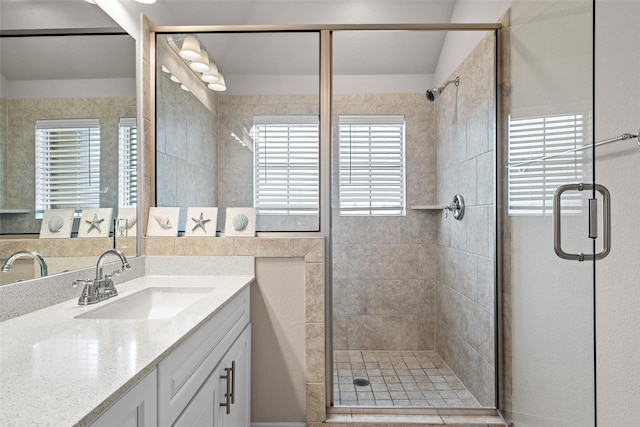 3657 Harebell Dr, Carrollton, TX 75007 - full bathroom featuring vanity, a stall shower, and plenty of natural light