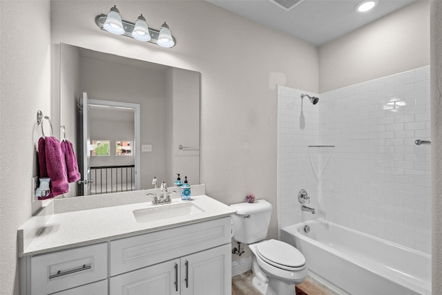 3657 Harebell Dr, Carrollton, TX 75007 - bathroom featuring toilet, vanity, and shower / washtub combination