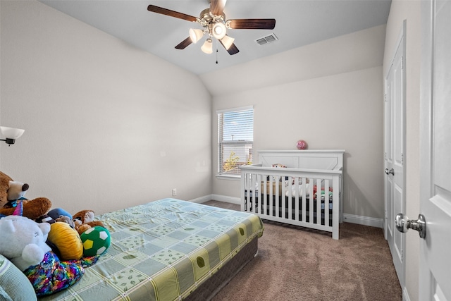 3657 Harebell Dr, Carrollton, TX 75007 - carpeted bedroom with baseboards, vaulted ceiling, and a ceiling fan