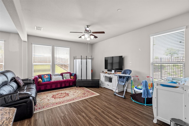 3657 Harebell Dr, Carrollton, TX 75007 - living area featuring plenty of natural light, wood finished floors, and a ceiling fan