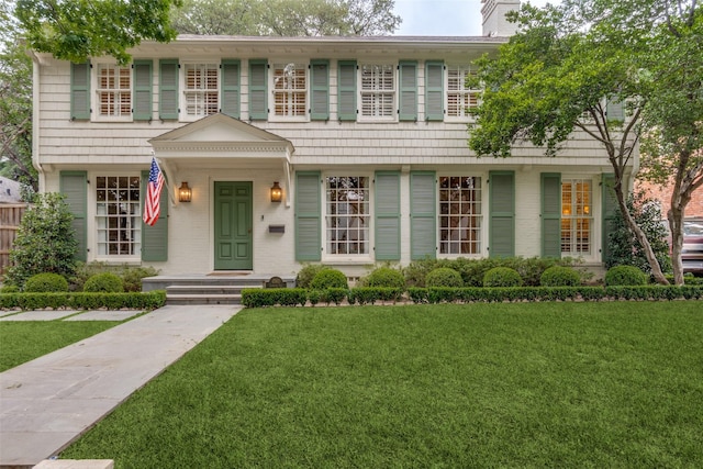 4560 Lorraine Ave, Highland Park, TX 75205 - view of front of property with a front lawn and a chimney