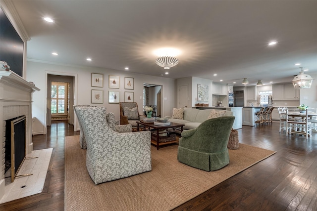 4560 Lorraine Ave, Highland Park, TX 75205 - living room featuring crown molding, recessed lighting, dark wood-style flooring, a fireplace, and baseboards