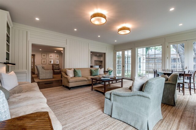 4560 Lorraine Ave, Highland Park, TX 75205 - living area featuring crown molding, french doors, a decorative wall, and recessed lighting
