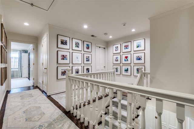 4560 Lorraine Ave, Highland Park, TX 75205 - corridor with ornamental molding, recessed lighting, wood finished floors, and an upstairs landing