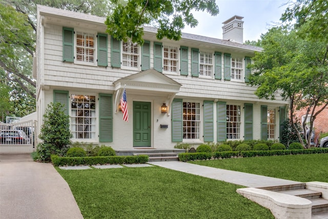 4560 Lorraine Ave, Highland Park, TX 75205 - view of front of property featuring a front lawn and a chimney