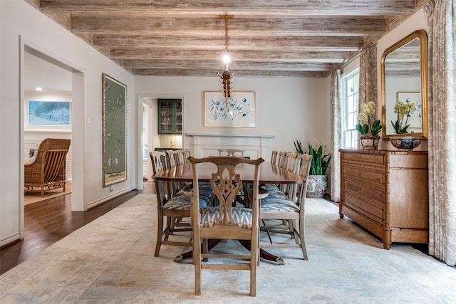 4560 Lorraine Ave, Highland Park, TX 75205 - dining room featuring wood finished floors and beamed ceiling