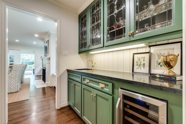 4560 Lorraine Ave, Highland Park, TX 75205 - indoor bar with crown molding, wine cooler, dark wood-style floors, recessed lighting, and baseboards