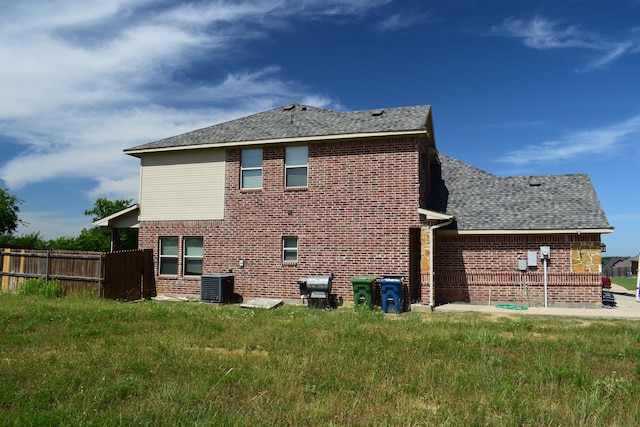 4909-4911 Villas Dr, Sanger, TX 76266 - rear view of property with brick siding, central air condition unit, and roof with shingles