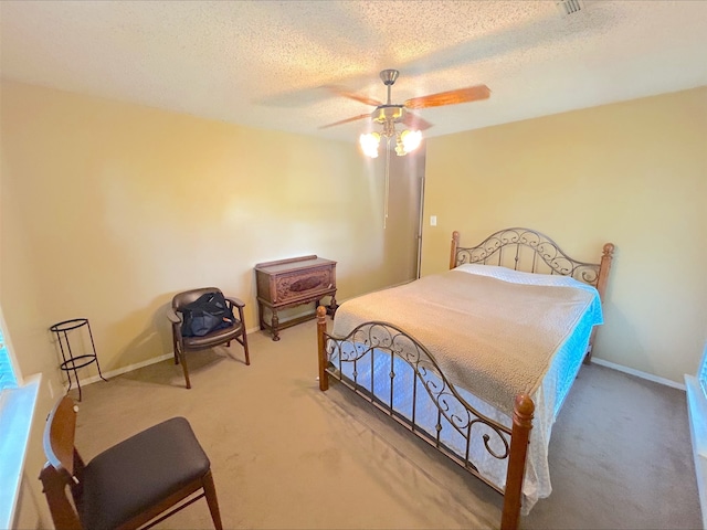 21363 Stevenson Rd, Frankston, TX 75763 - bedroom with carpet flooring, a textured ceiling, ceiling fan, and baseboards