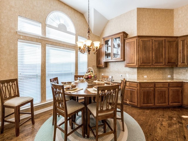 7805 Chapel View Dr, Mckinney, TX 75072 - dining room featuring plenty of natural light, a chandelier, dark wood-style floors, and high vaulted ceiling