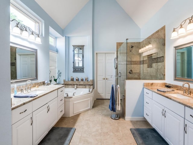 7805 Chapel View Dr, Mckinney, TX 75072 - full bath featuring a walk in shower, two vanities, a bath, and high vaulted ceiling