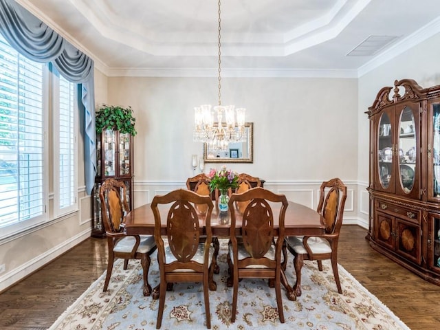 7805 Chapel View Dr, Mckinney, TX 75072 - dining area with a tray ceiling, a chandelier, plenty of natural light, wainscoting, and ornamental molding