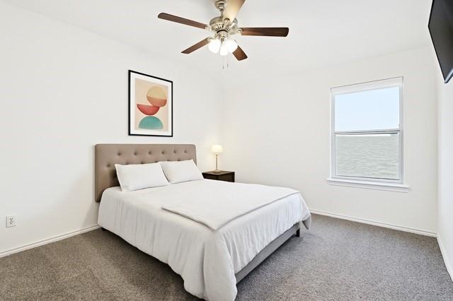 11216 Ponderosa Trl, Aubrey, TX 76227 - bedroom featuring carpet flooring, baseboards, and a ceiling fan
