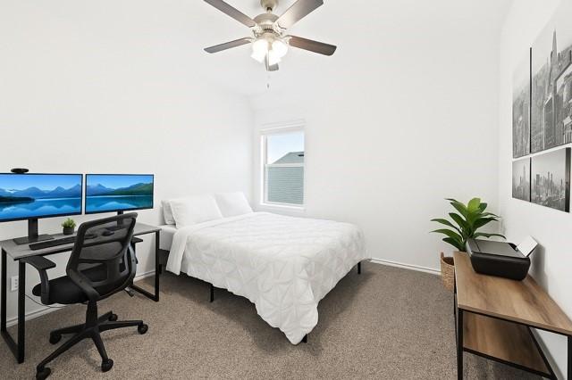 11216 Ponderosa Trl, Aubrey, TX 76227 - carpeted bedroom with an office area, baseboards, and a ceiling fan