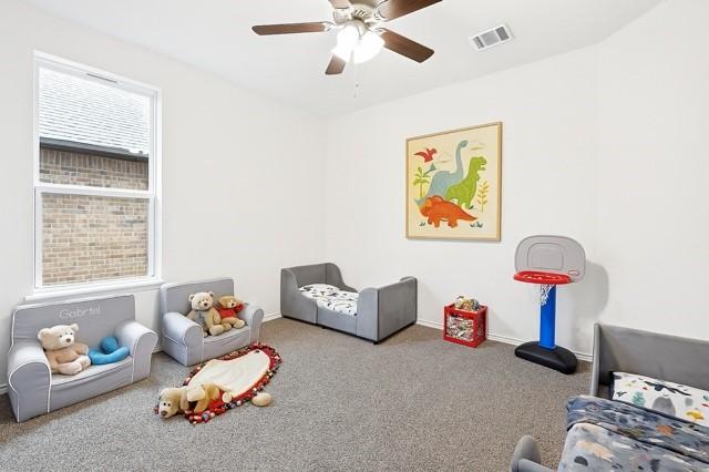11216 Ponderosa Trl, Aubrey, TX 76227 - bedroom featuring carpet, baseboards, and a ceiling fan