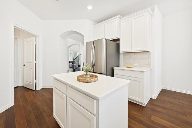 11216 Ponderosa Trl, Aubrey, TX 76227 - kitchen featuring freestanding refrigerator, arched walkways, dark wood-type flooring, light countertops, and recessed lighting