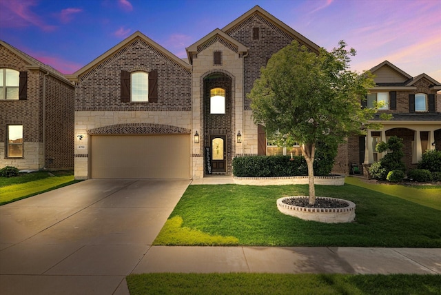 4708 River Edge Pl, Frisco, TX 75036 - view of front of property featuring stone siding, driveway, a yard, an attached garage, and brick siding