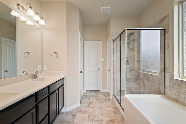 4708 River Edge Pl, Frisco, TX 75036 - full bath with a shower stall, double vanity, a garden tub, and baseboards