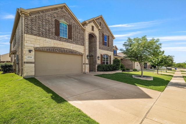 4708 River Edge Pl, Frisco, TX 75036 - french country home featuring stone siding, an attached garage, a front yard, concrete driveway, and brick siding