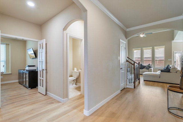 4708 River Edge Pl, Frisco, TX 75036 - hallway featuring arched walkways, light wood finished floors, crown molding, and baseboards