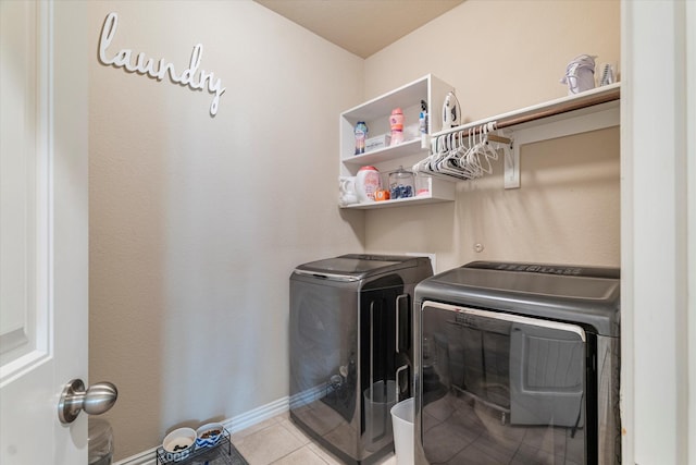 4708 River Edge Pl, Frisco, TX 75036 - laundry room featuring washing machine and clothes dryer, baseboards, and light tile patterned floors