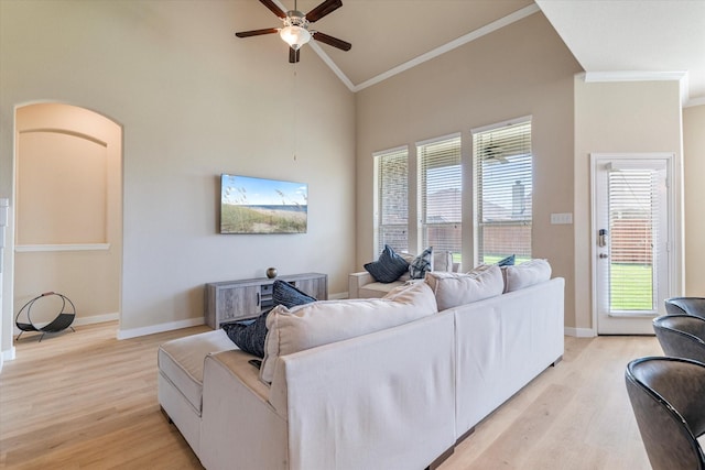 4708 River Edge Pl, Frisco, TX 75036 - living area with crown molding, light wood-style flooring, a ceiling fan, baseboards, and high vaulted ceiling