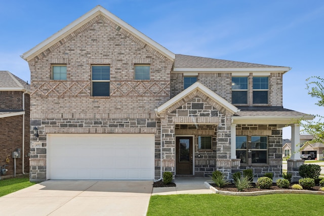 452 Ella Ln, Fate, TX 75087 - view of front of property featuring concrete driveway, a garage, and a porch
