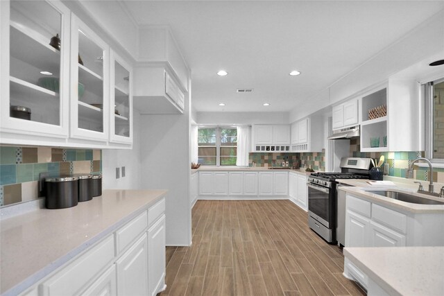 205 N College St, Mckinney, TX 75069 - kitchen featuring light wood-style flooring, white cabinetry, light countertops, and recessed lighting