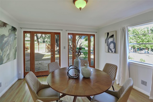 205 N College St, Mckinney, TX 75069 - dining area with light wood-style flooring, baseboards, and ornamental molding