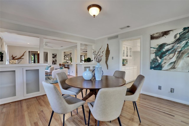 205 N College St, Mckinney, TX 75069 - dining space with light wood-style floors, ornamental molding, and baseboards