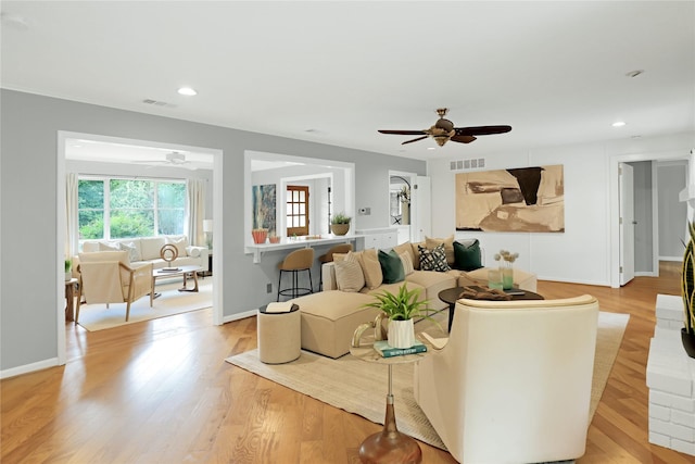 205 N College St, Mckinney, TX 75069 - living room with ceiling fan, recessed lighting, light wood finished floors, and baseboards