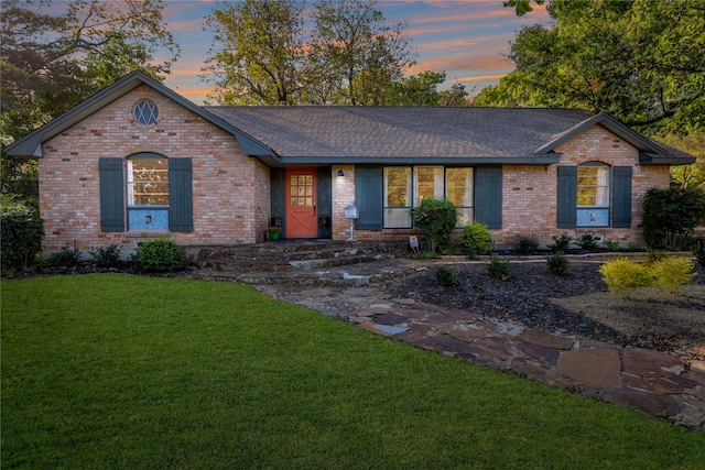 205 N College St, Mckinney, TX 75069 - ranch-style home featuring a yard, brick siding, and roof with shingles