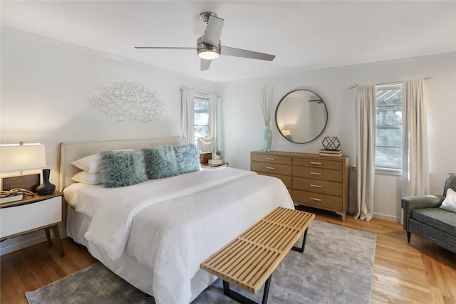 205 N College St, Mckinney, TX 75069 - bedroom with light wood-style floors and ceiling fan