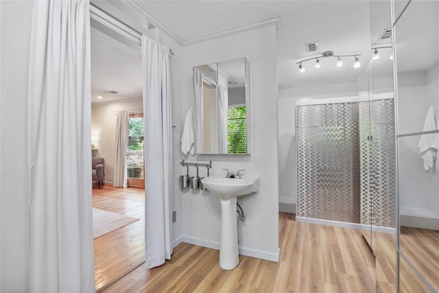 205 N College St, Mckinney, TX 75069 - full bath featuring ornamental molding, a stall shower, wood finished floors, and baseboards