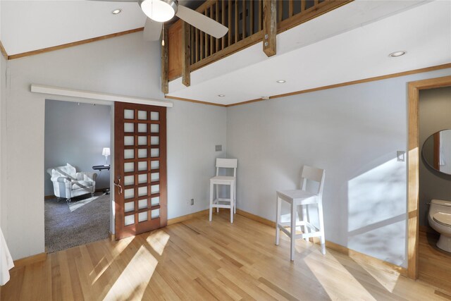 205 N College St, Mckinney, TX 75069 - unfurnished living room featuring wood finished floors, a ceiling fan, baseboards, recessed lighting, and high vaulted ceiling